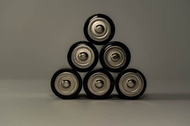 An EV battery pack with cooling channels and thermal management hardware visible between cell modules