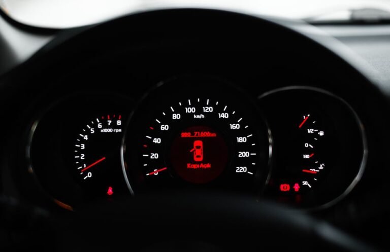 A car dashboard with the check engine light illuminated