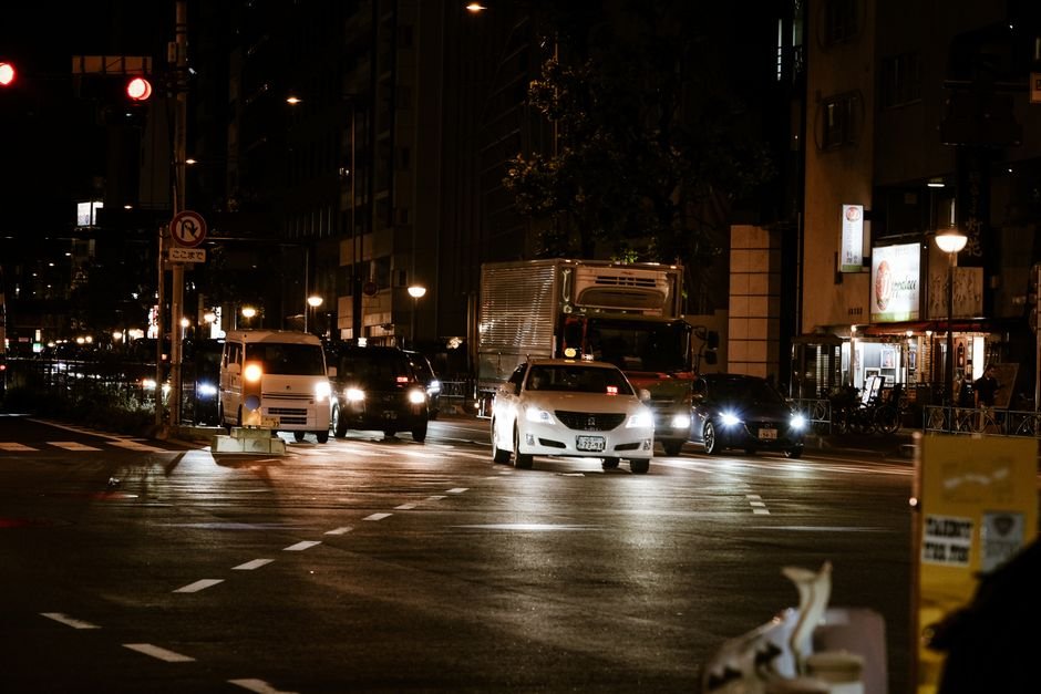 Car in a line of stop-and-go traffic on a city street