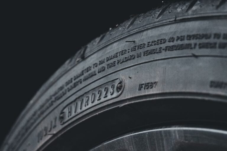 Close-up of tire sidewall showing size, load index, and speed rating markings