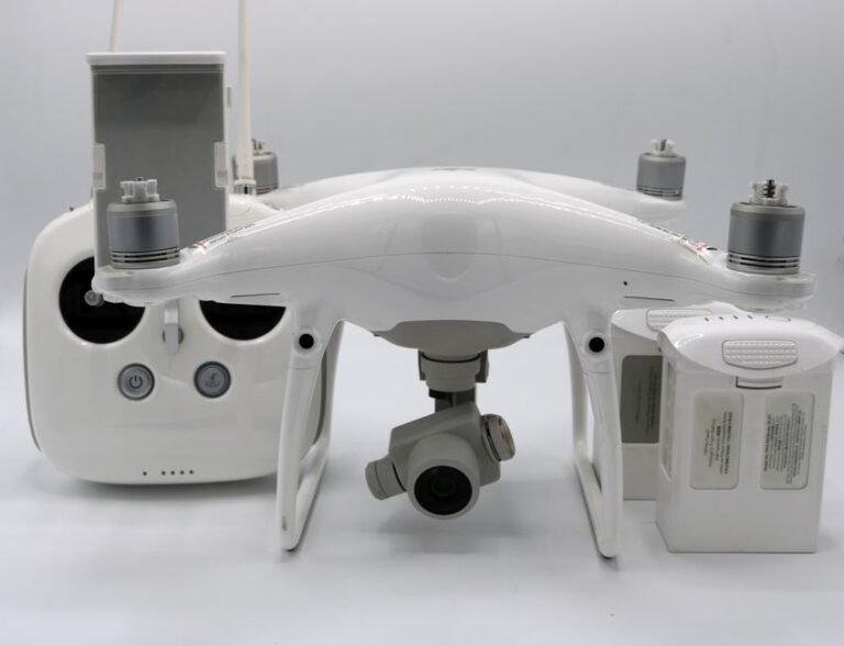 A drone battery pack being inserted into the battery compartment of a drone