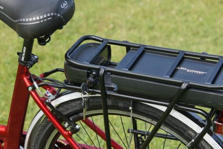 A lithium-ion battery pack mounted on the down tube of an e-bike frame