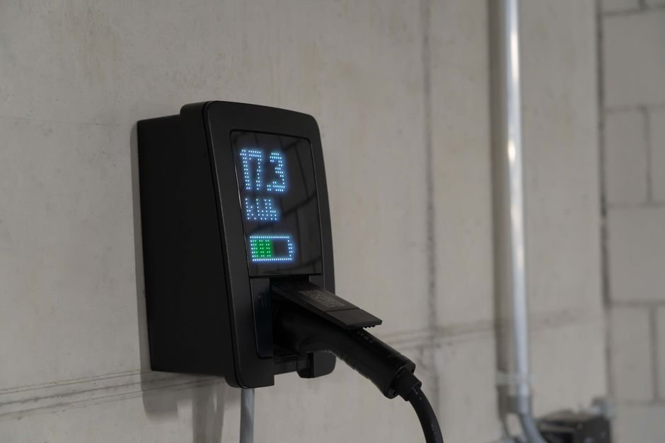 A close-up of a public DC fast charging station's payment and pricing screen