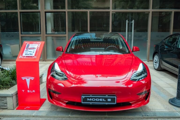 An electric car on display inside a dealership showroom