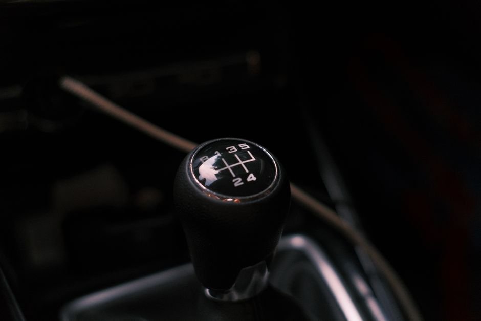 Close-up of a manual gear shifter inside a car
