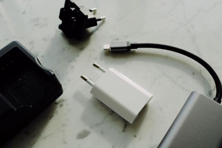 Several charging cables and power adapters spread out on a table